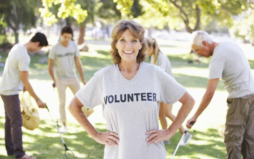woman wearing a white shirt that says volunteer in black writing